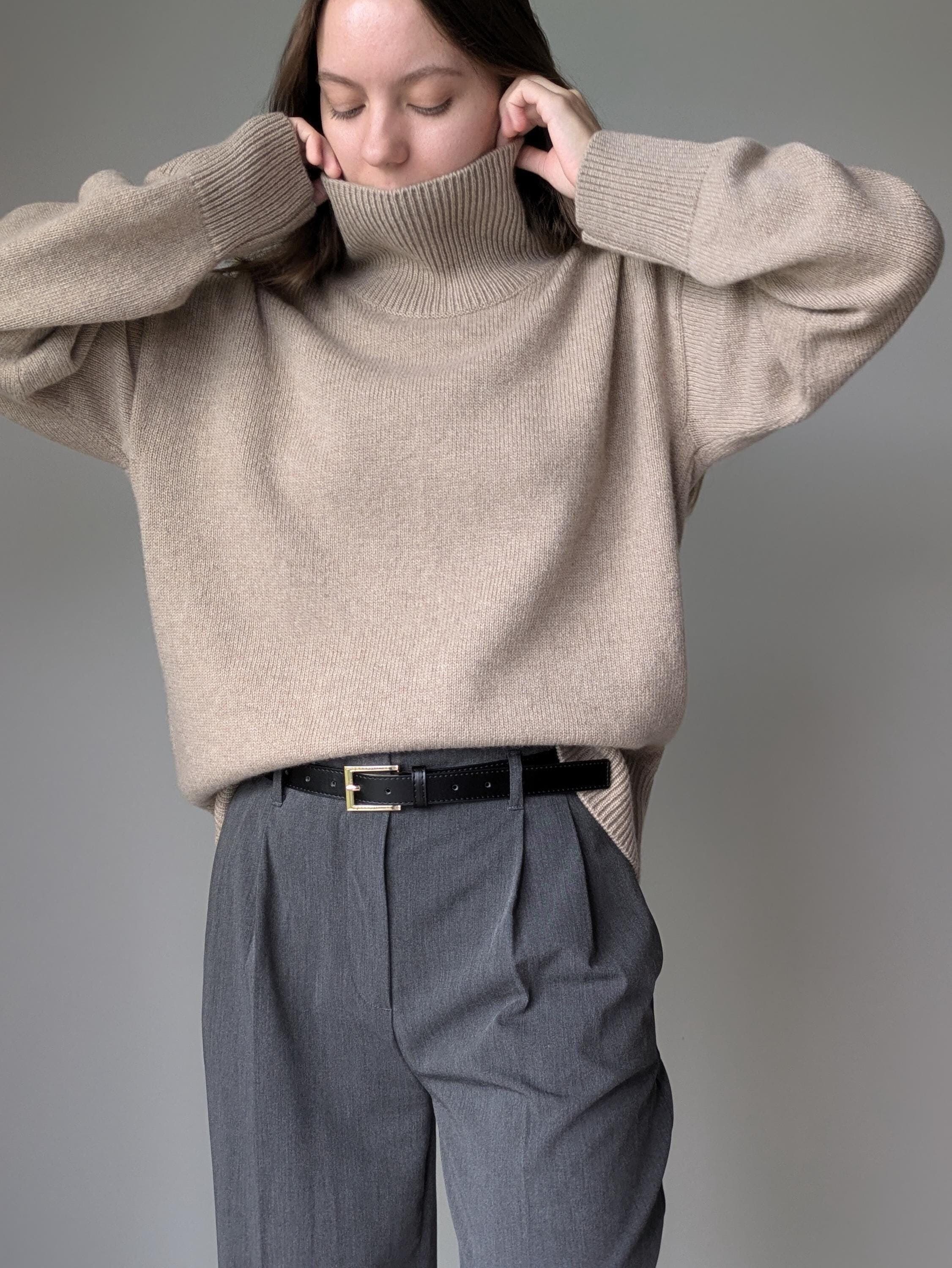 Beige merino cashmere turtleneck sweater, front view, hands up